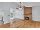 Spacious living room boasts an open layout, hardwood floors, and a glimpse into the kitchen area at 106 Chaff Ct, Summerville, SC 29485