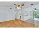 Bright and airy living area showing hardwood floors, open to the kitchen and outside patio at 106 Chaff Ct, Summerville, SC 29485