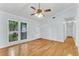 Open living area with hardwood floors, large window and a view to the entry door at 106 Chaff Ct, Summerville, SC 29485
