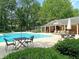 Community pool with tables, chairs, and lifeguard stand at 106 Chaff Ct, Summerville, SC 29485