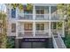 Beautiful home with a double front porch and garage space located beneath the house at 108 Carolina Blvd, Isle of Palms, SC 29451