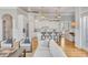 Spacious open concept living area leads to a modern kitchen with a breakfast bar and dining area at 108 Carolina Blvd, Isle of Palms, SC 29451