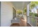 Relaxing porch view, showcasing comfortable seating and lush surrounding greenery at 108 Carolina Blvd, Isle of Palms, SC 29451