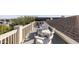 Enjoy outdoor living with these white Adirondack chairs on a private roof deck featuring lovely neighborhood views at 108 Carolina Blvd, Isle of Palms, SC 29451
