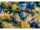 Overhead view of a stunning backyard featuring a large pool, patio area, and lush landscaping, surrounded by mature trees at 1081 Groves Manor Ct, Mount Pleasant, SC 29464