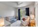 Bright Bedroom with crib, cozy armchair, and window with natural light at 1081 Groves Manor Ct, Mount Pleasant, SC 29464