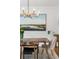Elegant dining room featuring modern lighting fixture, wainscoting, and an art piece; perfect for hosting at 1081 Groves Manor Ct, Mount Pleasant, SC 29464
