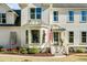 A pristine two-story home with a bay window, complemented by lush landscaping and traditional architectural details at 1081 Groves Manor Ct, Mount Pleasant, SC 29464