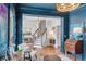 Bright foyer showcasing elegant staircase, chandelier, light hardwood floors, and beautiful open concept design at 1081 Groves Manor Ct, Mount Pleasant, SC 29464