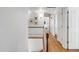 Bright hallway with hardwood floors, white trim, and access to multiple rooms at 1081 Groves Manor Ct, Mount Pleasant, SC 29464