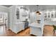 Gourmet kitchen boasts custom cabinetry, marble countertops, and a striking blue range with brass accents at 1081 Groves Manor Ct, Mount Pleasant, SC 29464