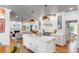 Spacious kitchen features a marble island, custom cabinets, and copper fixtures, open to the living room at 1081 Groves Manor Ct, Mount Pleasant, SC 29464