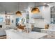 Gourmet kitchen featuring white cabinets, marble countertops, and an open layout to the living area at 1081 Groves Manor Ct, Mount Pleasant, SC 29464