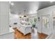 Stunning white kitchen with marble countertops, large island, and adjoining breakfast area with abundant natural light at 1081 Groves Manor Ct, Mount Pleasant, SC 29464