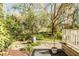 Lush landscaping surrounds the concrete walkway in the backyard. Mature trees provide shade and privacy at 1081 Groves Manor Ct, Mount Pleasant, SC 29464