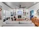 Comfortable living room with fireplace, built-in bookshelves, and natural light at 1081 Groves Manor Ct, Mount Pleasant, SC 29464