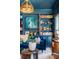 Comfortable living room features beautiful built-in shelving, eye-catching blue paint, and tasteful decor at 1081 Groves Manor Ct, Mount Pleasant, SC 29464