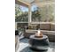 Relaxing screened porch features comfortable seating and a coffee table at 1081 Groves Manor Ct, Mount Pleasant, SC 29464