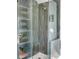 Elegant bathroom with a glass-enclosed shower featuring stylish green tiling and modern fixtures at 1081 Groves Manor Ct, Mount Pleasant, SC 29464
