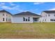 Home with a lush green backyard and manicured lawn at 109 Crosscut Ln, Summerville, SC 29486