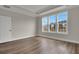 Bedroom with hardwood floors and a large window offering exterior views at 109 Crosscut Ln, Summerville, SC 29486