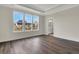 Bright bedroom with hardwood floors, ample windows, and an ensuite bathroom at 109 Crosscut Ln, Summerville, SC 29486