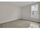 Cozy bedroom with neutral carpet and a large window providing natural light at 109 Crosscut Ln, Summerville, SC 29486