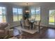 Dining area with lots of light from large windows, seating for six, and modern decor at 109 Crosscut Ln, Summerville, SC 29486