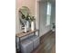 Inviting foyer with wood floors, a decorative mirror, console table, and view of the staircase at 109 Crosscut Ln, Summerville, SC 29486