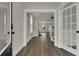 Open hallway with hardwood floors looking into the living room at 109 Crosscut Ln, Summerville, SC 29486