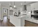 Modern kitchen with white cabinets, stainless steel appliances, and a center island at 109 Crosscut Ln, Summerville, SC 29486