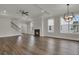 Spacious living room with a fireplace, hardwood floors, and large windows at 109 Crosscut Ln, Summerville, SC 29486