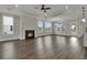 Spacious living room with a fireplace, hardwood floors, and large windows at 109 Crosscut Ln, Summerville, SC 29486