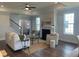 Bright living room featuring hardwood floors, a fireplace, and a staircase at 109 Crosscut Ln, Summerville, SC 29486