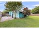 Spacious backyard with lush lawn and mature trees, creating a private outdoor retreat at 1135 Shoreham Rd, Charleston, SC 29412