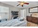 Bedroom featuring a ceiling fan, dresser, and a well-lit window at 1135 Shoreham Rd, Charleston, SC 29412