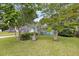 Well-manicured front yard with a mix of trees and shrubs, enhancing curb appeal at 1135 Shoreham Rd, Charleston, SC 29412