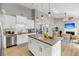 Modern kitchen featuring stainless steel appliances, a large island with marble countertops, and open layout at 1135 Shoreham Rd, Charleston, SC 29412
