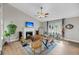 Inviting living room featuring a fireplace, cozy seating, and plenty of natural light and a guitar at 1135 Shoreham Rd, Charleston, SC 29412