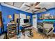 Music room with blue walls features ceiling fan, and a desk with recording equipment at 1135 Shoreham Rd, Charleston, SC 29412
