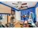 Music room with blue walls features ceiling fan, and a desk with recording equipment at 1135 Shoreham Rd, Charleston, SC 29412
