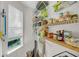 Pantry with window features wire and wood shelving for optimal storage at 1135 Shoreham Rd, Charleston, SC 29412