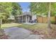 Backyard with covered patio, grill, fire pit, concrete patio, and fully fenced yard at 115 Ridge Rd, Summerville, SC 29485