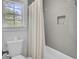 Tiled shower and tub combination with window at 115 Ridge Rd, Summerville, SC 29485