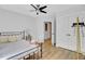 Bedroom features a fan, bedside table, and closet for a tidy space at 115 Ridge Rd, Summerville, SC 29485