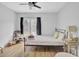 Cozy bedroom featuring a ceiling fan, natural light, and decorative furnishings at 115 Ridge Rd, Summerville, SC 29485
