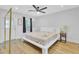 Bright bedroom featuring a ceiling fan, a comfortable bed, and windows that bring in natural light at 115 Ridge Rd, Summerville, SC 29485