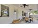 The covered patio is perfect for grilling and entertaining with multiple ceiling fans at 115 Ridge Rd, Summerville, SC 29485