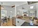 Open concept kitchen features stainless steel appliances, granite countertops, and open floorplan into living room at 115 Ridge Rd, Summerville, SC 29485