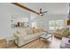 Spacious living room with wood floors, comfortable seating, and open layout to the kitchen at 115 Ridge Rd, Summerville, SC 29485